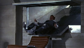 Bond slides into a chair